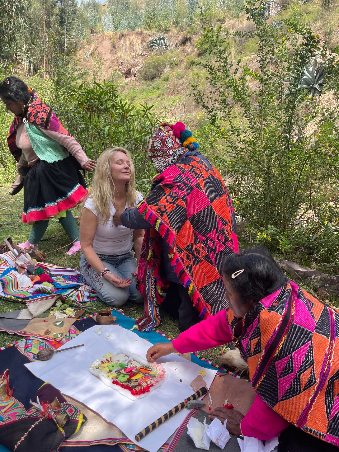 Kristen receiving a sacred ceremony from Q'ero shamans in the Andes