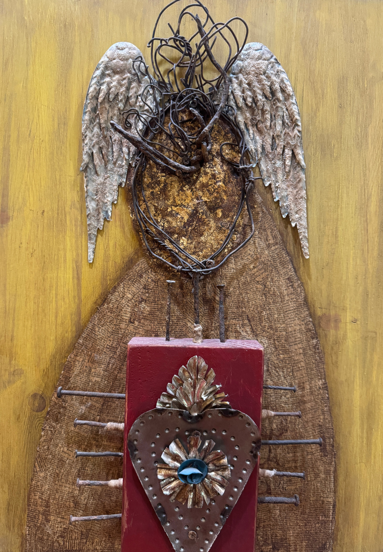 Mixed-media winged sacred heart sculpture