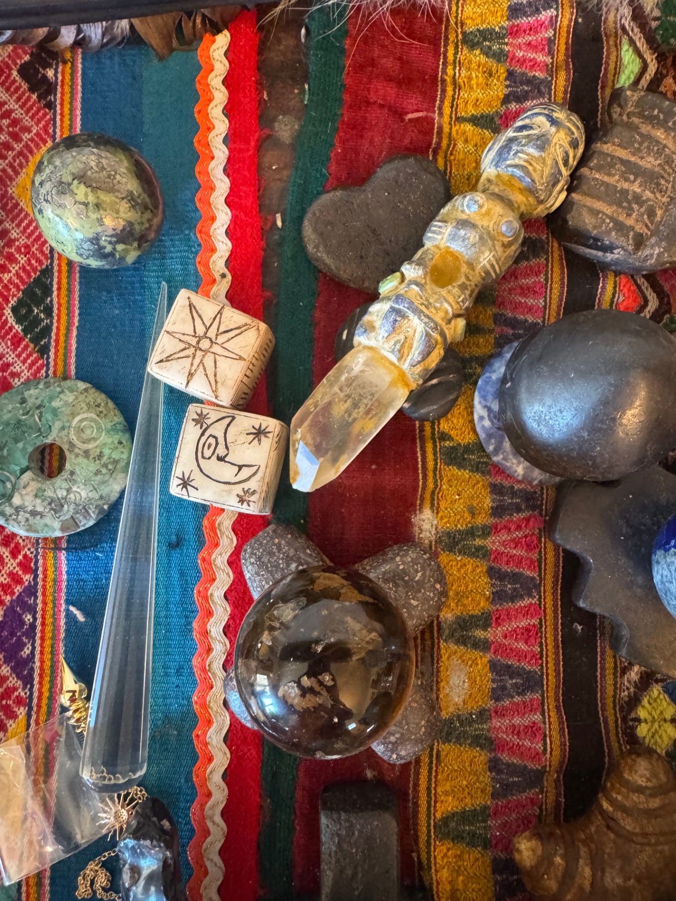 Sacred mesa objects, stones and crystals on a woven Andean textile
