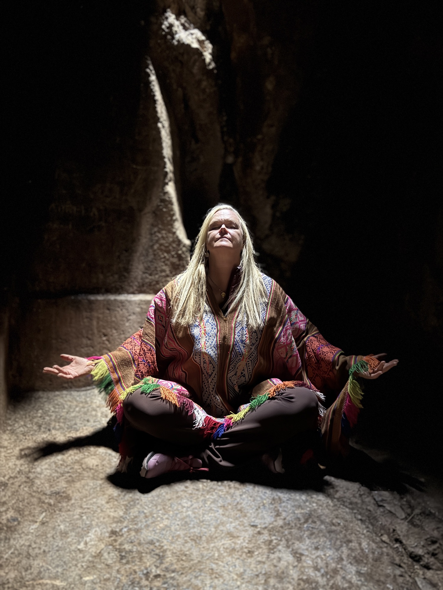 Kristen White in seated meditation during a sacred ceremony in the Andes
