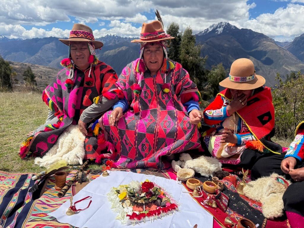 Andean Q'ero shamans seated for a despacho ceremony - Shamanic Trekker