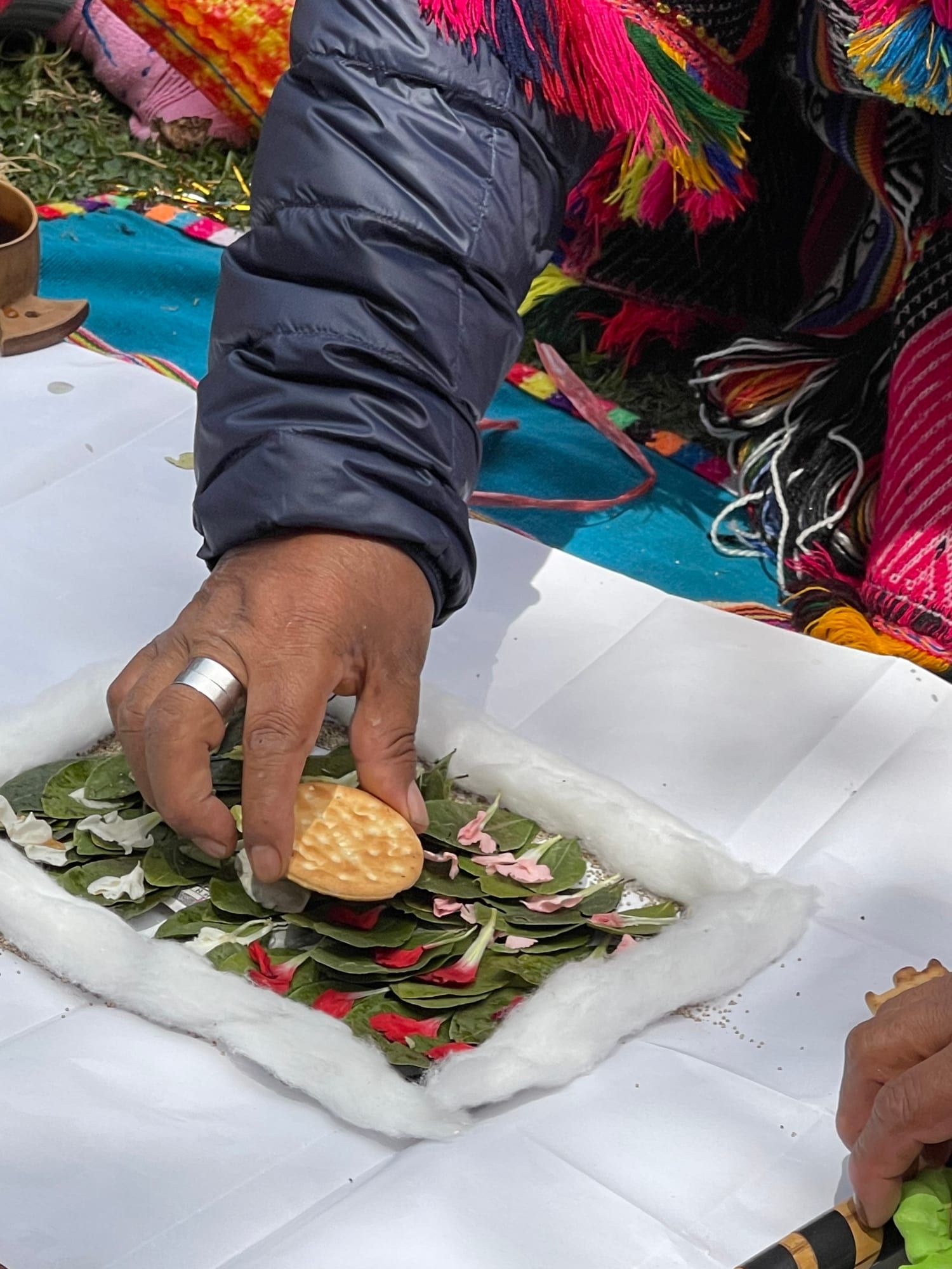 Placing a kuya stone on the despacho - sacred stones - Shamanic Trekker