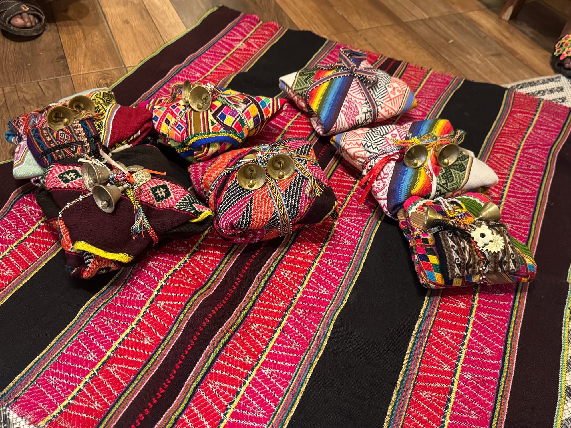 Sacred ceremonial bundles and offerings laid out on a woven Andean cloth — Shamanic Trekker Events and Gatherings