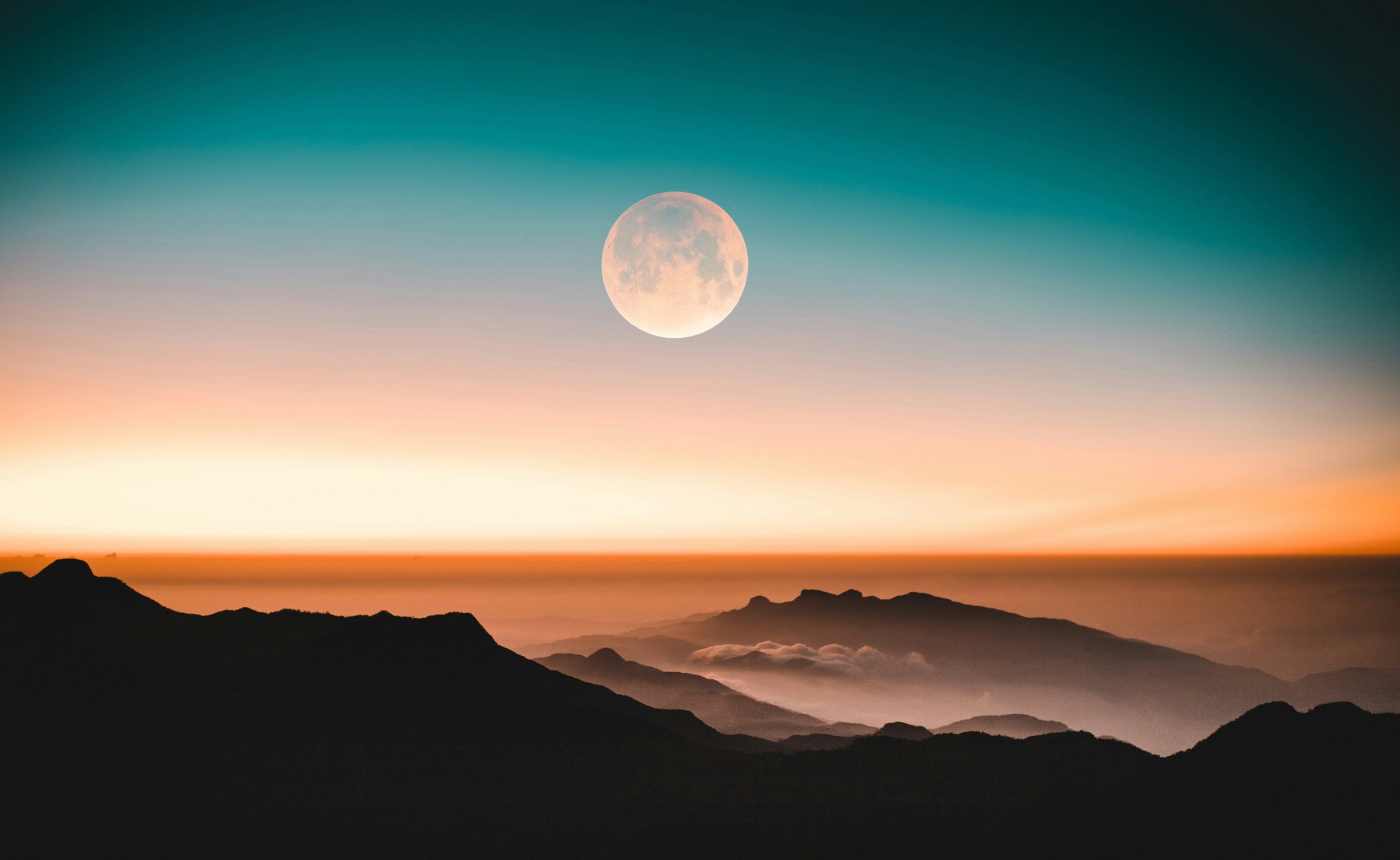 The Cold Moon over mountains at the turning point of the Winter Solstice