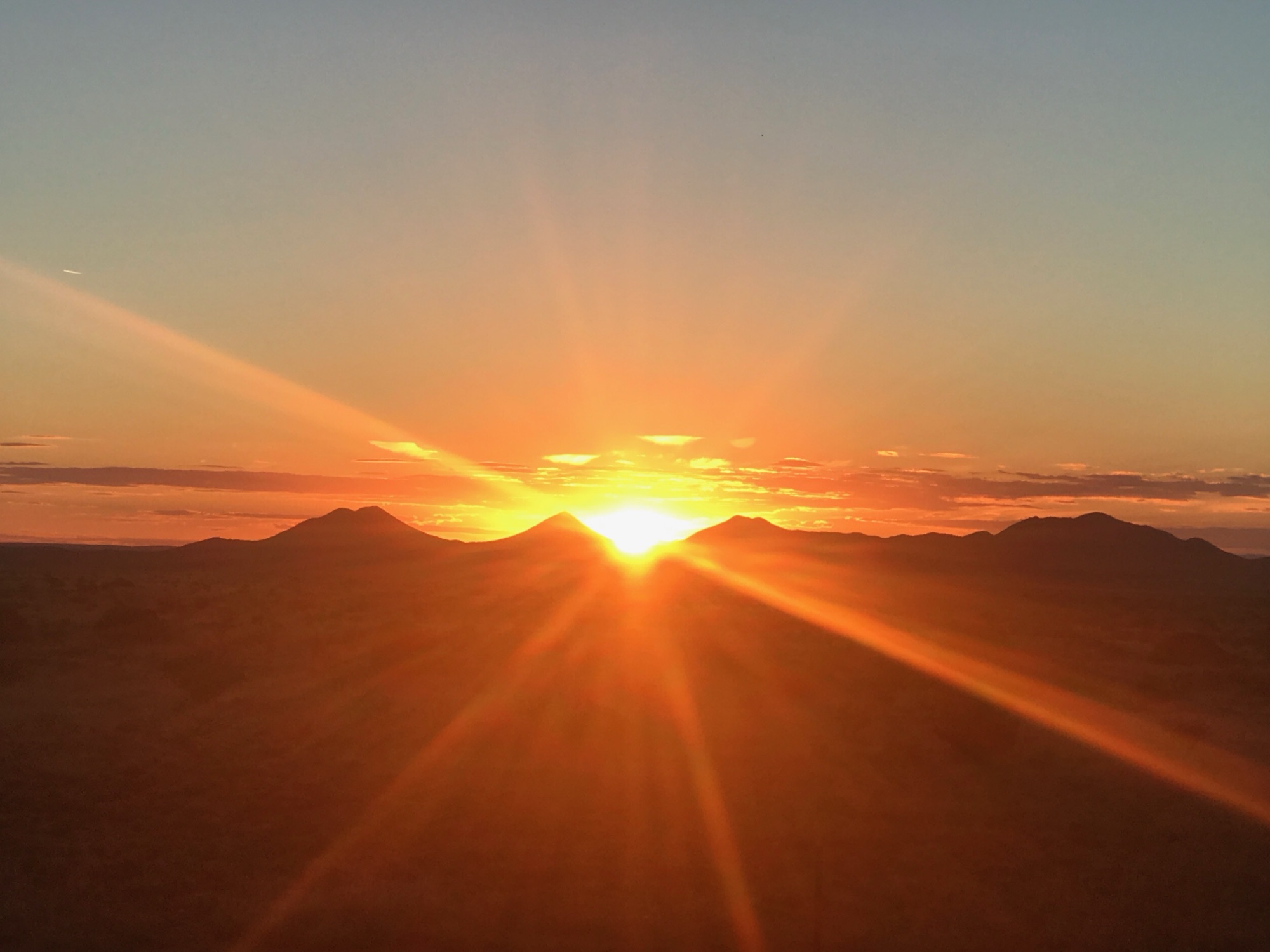 A vivid sunrise over the mountains near Santa Fe, New Mexico - Shamanic Trekker